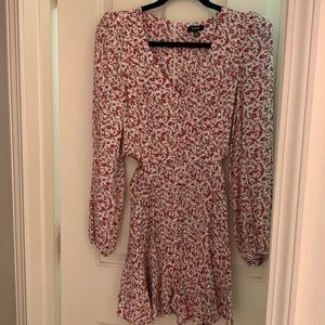 Floral long sleeve dress with side cut outs in waist area , zip down in back